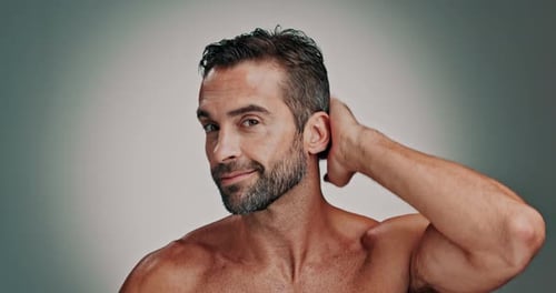 Model, man and face with hair care in studio, wellness or satisfaction with collagen treatment