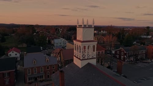Cinematic Drone Footage Capturing a Quaint Small Town With Its Prominent Church Steeple