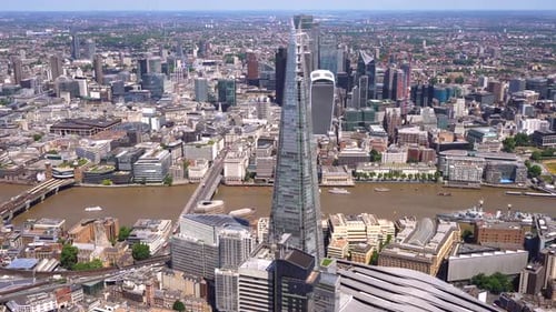 London Bridge, Thames river, past the Shard with the City of London tower cluster behind.