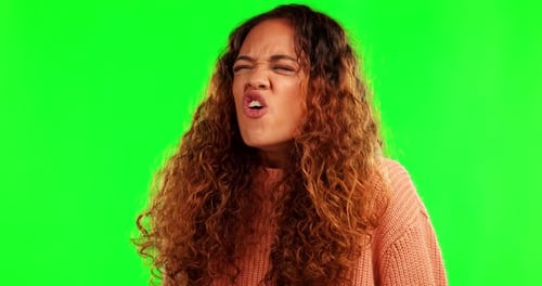 Angry, screaming and woman in green screen studio with stress, problem or conflict, crisis or issue