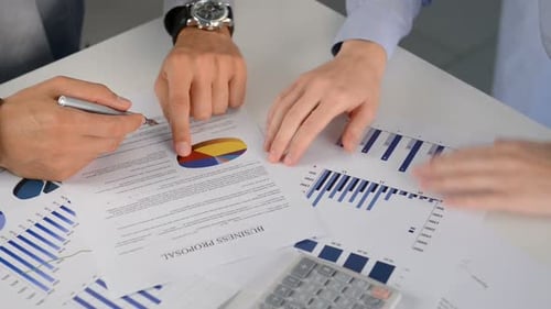 Close up of businesspeople handshaking over a new financial agreement