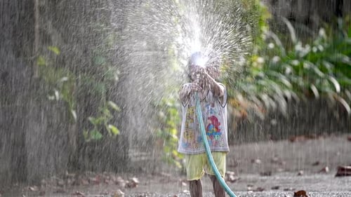 Happy Boy Play at Park Vietnam Water Hose Drops Fun Childhood Cheerful Child