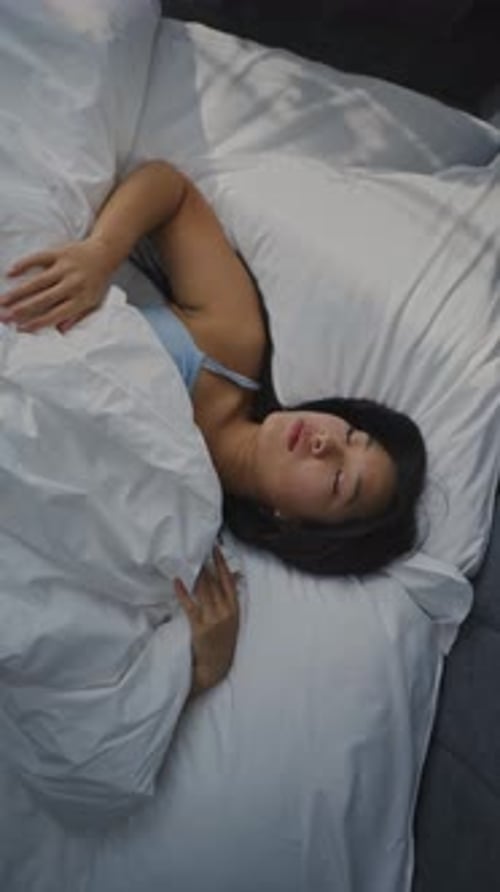 Young Girl Wakes Up Early in Morning in Bedroom