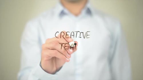 Creative Team Man Writing on Transparent Screen