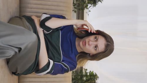 Vertical video of The young woman who got bad news on the phone.