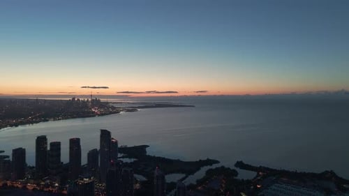 Drone Aerial View of Parklawn Neighbourhood, Lake Ontario and Toronto Skyline at Sunrise