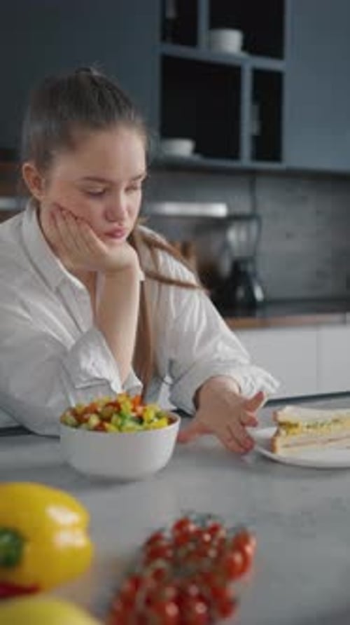 Pensive Woman Choose Healthy Food on Diet Obese Girl Chooses Between a Sandwich and Vegetables Makes