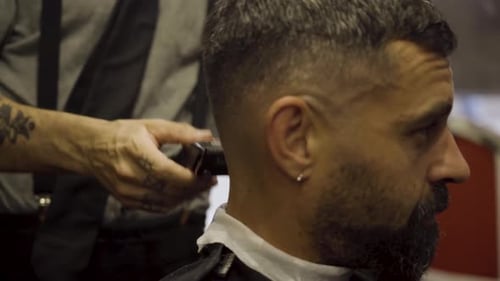 Hairstylist With Razor On A Barber Shop. Hair Cut For Male. Close Up