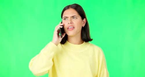 Green screen, phone call and woman with anger, frustrated and stress against a studio background