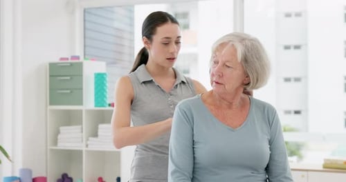 Woman, physiotherapy and helping senior patient with rehabilitation of body pain