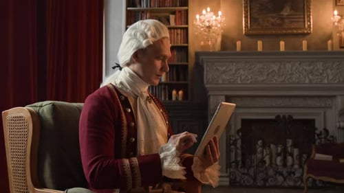 Actor in Victorian Gentleman Costume Checking Storyboard on Tablet on Drama Set