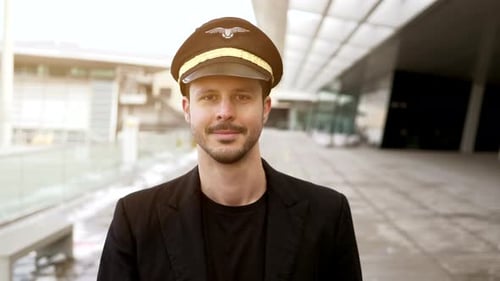 Portrait of Proffesional Male Pilot Captain Working in Aviation Business