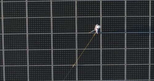 Aerial shot of maintenance assistance technical worker in uniform is smiling satisfied of his work