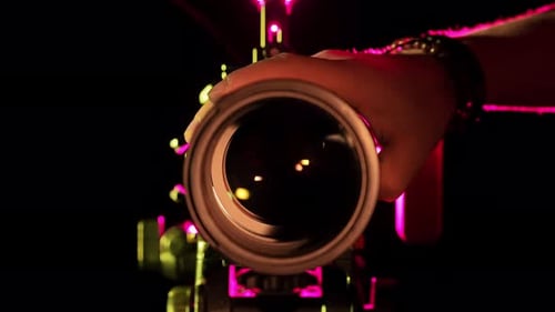 Capturing Light A Hand Adjusts Professional Camera Lens in Studio