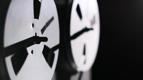 Spinning ReeltoReel Tape Spools on a Dark Background