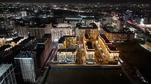 Aerial night view of Bishkek city buildings with lights
