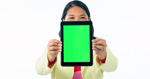 Face, woman and advertising tablet with green screen, ux space and sign up offer in studio on white