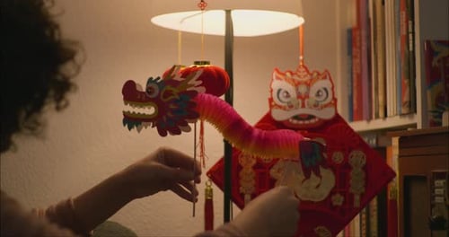 Young Woman Playing With A Chinese Dragon Decoration