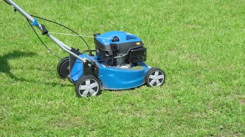 Lawn Mower Cutting Grass Small Grass Cuttings Fly Out of Lawnmower Grass Clippings Get Spewed Out of