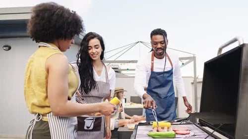 Friends Grilling Food on Rooftop Barbecue