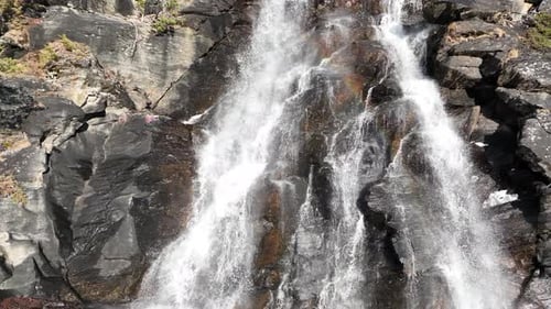 Waterfall in mountains. Outdoor nature in Norway