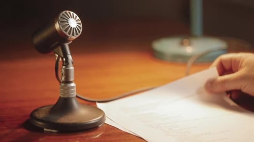 The announcer reads the text before the microphone