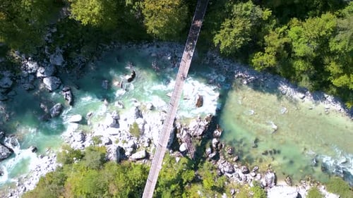 Aerial drone view of a bridge crossing the Soca river in Slovenia