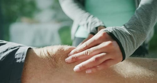 Physiotherapist, people and hands massage knee, legs or anatomy care for muscle injury