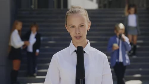 Portrait of Little Female TV Reporter Talking with Microphone for News Episode About Politics