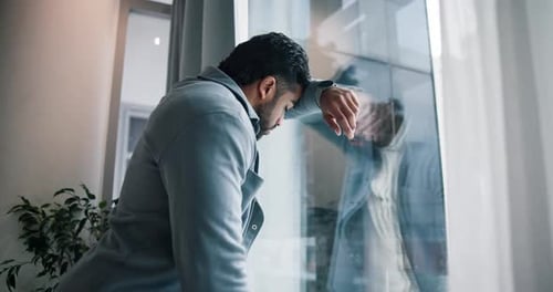 Stress, worry and business man by window with anxiety for failure, job loss or bankruptcy