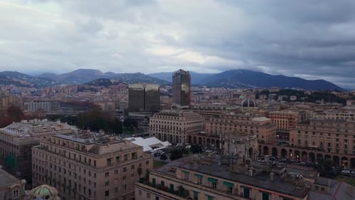 Central Downtown of Genoa City, Italy, Aerial Drone fly Cityscape with mountain background, European