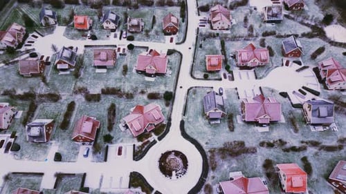 Roundabout streets and luxury houses covered with snow in Roompot Arcen