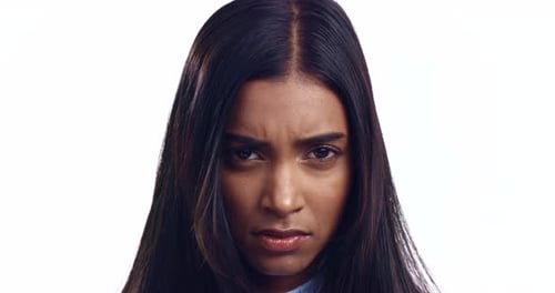 Angry, face and woman in studio with problem, conflict or frustrated by fake news on white