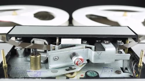 Rewinding And Playing A Reel Tape On A Four Track Reel Tape Recorder 1.