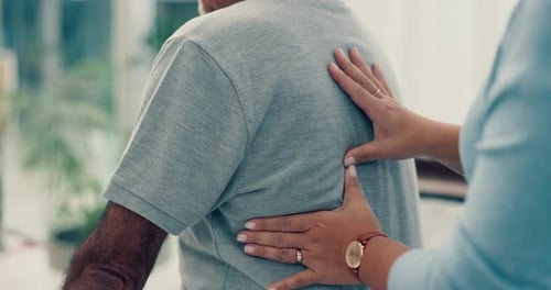 Hands of physiotherapist, massage or physiotherapy for back pain to help in physical therapy