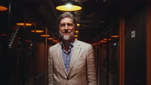 Asian Businesswoman Standing in Office Hallway