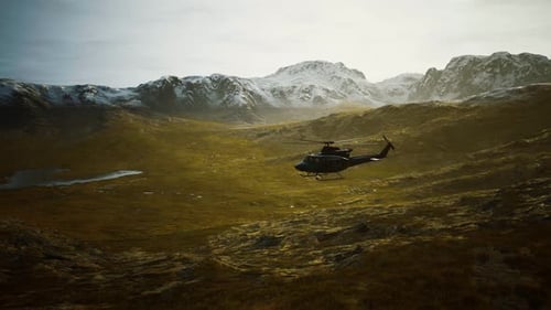 Slow Motion Vietnam War Era Helicopter in Mountains