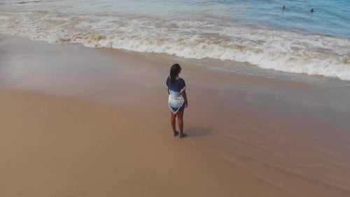 A model enjoying beach views in a fishing village on the North Western coast of Tobago, Castara