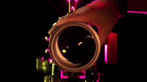 Capturing Light A Hand Adjusts Professional Camera Lens in Studio
