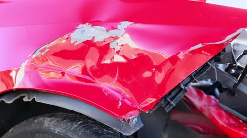 Road Accident - Red Car Involved In A Head-on Collision. - close up shot