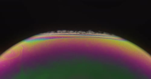 Colorful Surface Of Soap Bubble In Black Background. - macro