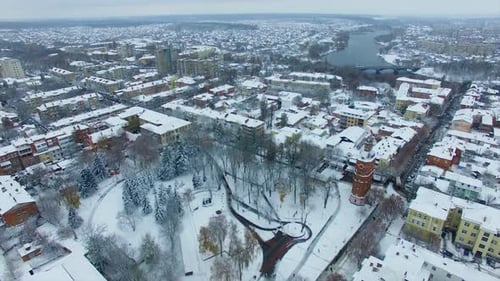 Panorama of the beautiful city covered with snow. Drone footage over the urban landscape