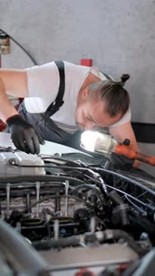 Vertical Video Professional Car Mechanic Repairs Car Engine Modern Car Service Vertical Video