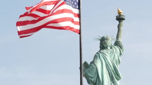 Statue of Liberty on Liberty Island New York USA Flag and Monument Patriotic Symbol of Democracy