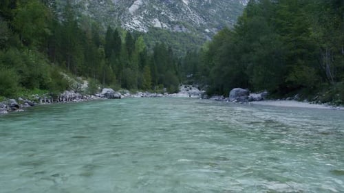 Aerial view of serene river valley at sunrise, Julian Alps, Soca, Slovenia.