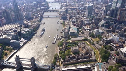 Aerial view of Tower Bridge and the Thames river, view from east to west. View of the London City to