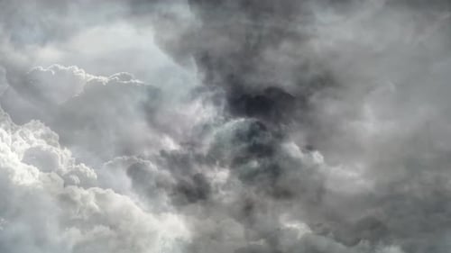 a thunderstorm that flashed inside the thick cumulus cloud and moved