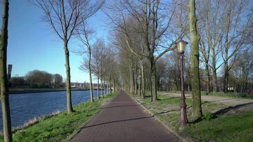 Empty walkway at Riverside public Park, Amsterdam, slow motion, March 2021