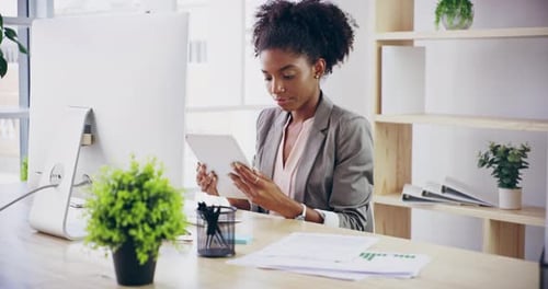 Black woman, office worker and employee with digital tablet at company desk in modern advertising