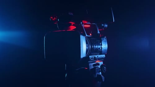 Mysterious Camera Silhouette in Blue and Red Lighting